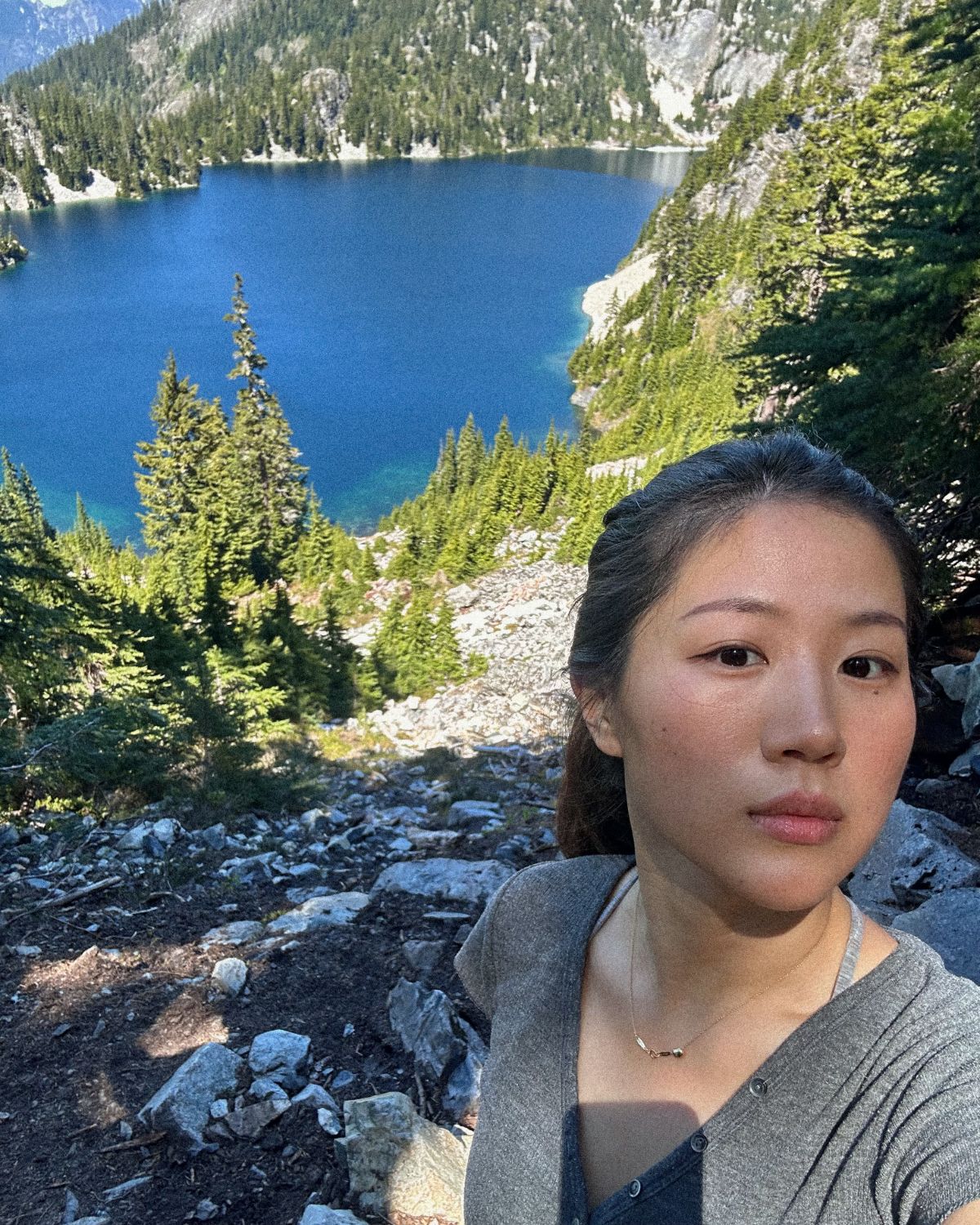Kate on a hike above an alpine lake